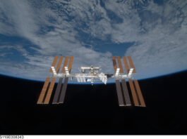 Understanding the International Space Station for Middle Schoolers Backdropped by the blackness of space and Earth