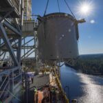 NASA Stennis Reaches Key Step for Upcoming Artemis Tests interstage simulator component suspended in air by crane