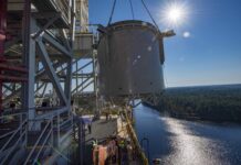 NASA Stennis Reaches Key Step for Upcoming Artemis Tests interstage simulator component suspended in air by crane