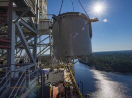 NASA Stennis Reaches Key Step for Upcoming Artemis Tests interstage simulator component suspended in air by crane