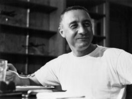 Virgil Grissom, also known as “Gus,” honored in new exhibit. Grissom wears a t-shirt while eating a meal after his Mercury-Redstone 4 flight.