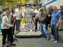 NASA Recognized Among Top U.S. Employers for Veterans Group photo of NASA SkillBridge employees around an Astronaut suit at the JSC Neutral Buoyancy Laboratory.