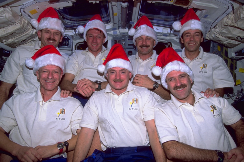 sts 103 19 crew inflight w santa hats 1.jpg 25 Years Ago: STS-103, The Hubble Servicing Mission-3A - NASA