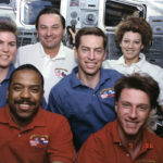 30th Anniversary of STS-63: Shuttle-Mir’s Historic Rendezvous A group photo of six astronauts, four men and two women, taken on the shuttle