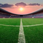 Lenovo Enhances FIFA World Cup 2026 Operations with AI-Driven Technology Football stadium at sunset