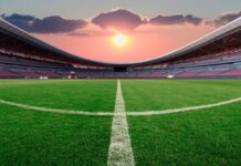 Lenovo Enhances FIFA World Cup 2026 Operations with AI-Driven Technology Football stadium at sunset