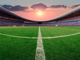 Lenovo Enhances FIFA World Cup 2026 Operations with AI-Driven Technology Football stadium at sunset