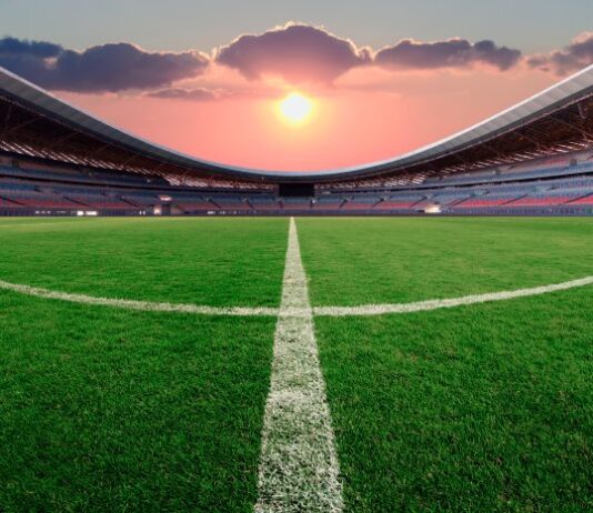 Lenovo Enhances FIFA World Cup 2026 Operations with AI-Driven Technology Football stadium at sunset