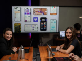 RadarFit AI Promotes Unique Healthy Habit Incentives Multiple people sitting at a table with a projector screen in the background