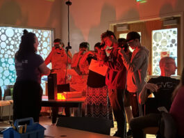 NASA’s Unforgettable 2024 Highlight A group of students peer through devices