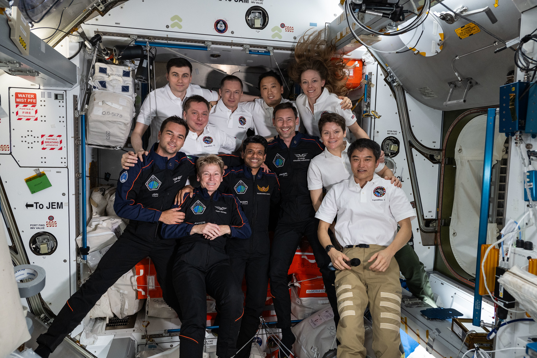 the axiom mission 4 and expedition 73 crews take a group portrait.jpg The Axiom Mission 4 and Expedition 73 crews, join together and smile for a group portrait inside the International Space Station