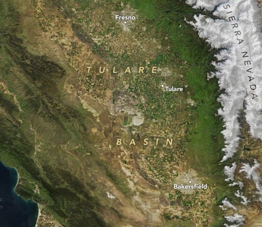 NASA Employs High-Tech Radar for California Groundwater Monitoring Satellite image of the Tulare Basin area in Southern California, showing a mix of foothills and farmlands.