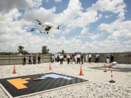 NASA Explores UTM BVLOS for Uncrewed Aircraft Traffic Management NASA, along with members of the FAA and commercial drone engineers, gather outside to view a drone demonstration flight by Wisk on May25, 2024.