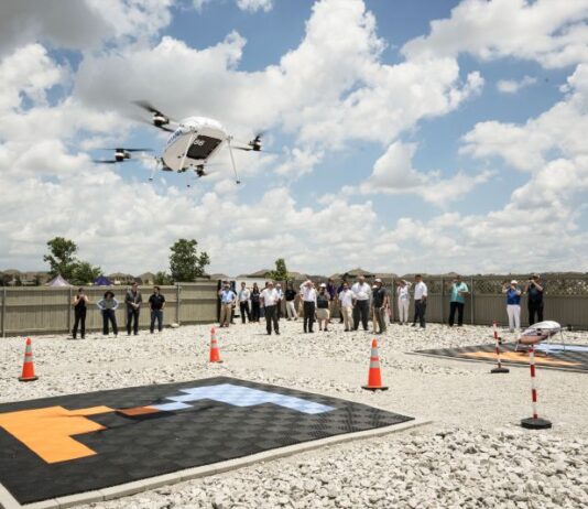 NASA Explores UTM BVLOS for Uncrewed Aircraft Traffic Management NASA, along with members of the FAA and commercial drone engineers, gather outside to view a drone demonstration flight by Wisk on May25, 2024.