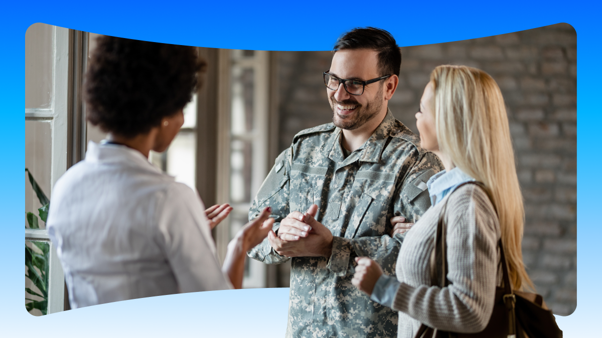 vha deploys salesforce powered agentic operating system saving thousands of staff hours for frontlin.png Smiling man in army fatigues discussing care options with woman.