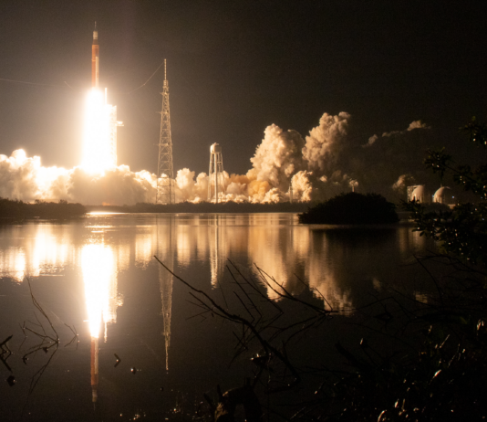 NASA Unveils New Virtual Backgrounds Celebrating Artemis Missions Framed by vegetation in the foreground and against the backdrop of a black night sky, NASA’s SLS (Space Launch System) rocket carrying the Orion spacecraft launches on the Artemis I flight test on Nov. 16, 2022, from Launch Complex 39B at NASA’s Kennedy Space Center in Florida.