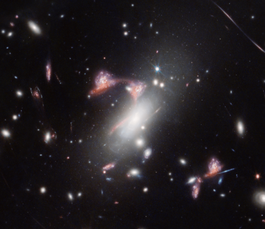 Webb Telescope Finds Distorted Galaxy Shaped Like Cosmic Question Mark NASA Logo