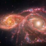 NASA’s Webb, Hubble Explore Blood-Red Galaxy Pair NASA Logo