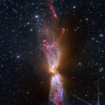 NASA Webb Reveals Stunning Details of Star Formation At the center is a thin vertical cloud known as Lynds 483 that is shaped like an hourglass with irregular edges. At lower center are two discrete bright white, tiny blobs of light that have raced away from the hidden central stars. The top lobe shows a more prominent orange U-shape. Orange bleeds into light purple, and brighter pink at its edges. Some background stars are visible through sections of this lobe. Higher up, there is an orange arc. Some brighter pink material extends to the top edges near the center. In the lower lobe, less orange is visible. More opaque light purple is in its top third, rippling out into semi-transparent blues and pinks. The lower lobe has more texture. V-shapes left and right of the lobes are darkest, and the background stars in these areas appear orange. Elsewhere, the black background of space is clearer, speckled with tiny white stars and faint orange galaxies.