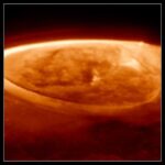 Webb Telescope Uncovers Jupiter’s Aurora Secrets and Mysteries Three panels, each showing a close-up near-infrared image of Jupiter’s north pole, in shades of orange. The planet is mostly dark. Thick, bright arcs and rings caused by auroras cover the pole. The center and right panels each show the aurora a few minutes later in time, as Webb’s field of view slowly scans over the planet.