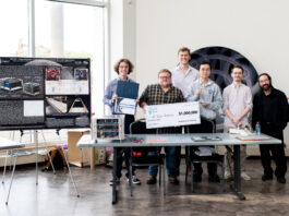 NASA’s Watts on the Moon Challenge Concludes with $1.5M Prizes At the Great Lakes Science Center in Cleveland, Ohio, Team H.E.L.P.S. (High Efficiency Long-Range Power Solution) from The University of California, Santa Barbara pose with their $1 million check and the power transmission and energy storage hardware that won them the grand prize in the four-year competition. The team is comprised of six faculty researchers at UC Santa Barbara, led by team lead Dr. Philip Lubin (far right).