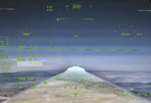 NASA’s X-59 Aircraft Achieves First Supersonic Flight NASA’s X 59 eXternal Vision System digital display shows green flight data overlaid on the forward scenery as the aircraft flies supersonic. Numerical indicators, horizon references, and a Mach number readout are visible on the screen.