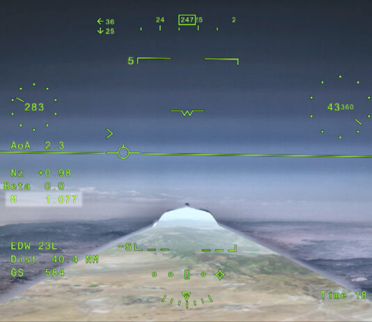 NASA’s X-59 Aircraft Achieves First Supersonic Flight NASA’s X 59 eXternal Vision System digital display shows green flight data overlaid on the forward scenery as the aircraft flies supersonic. Numerical indicators, horizon references, and a Mach number readout are visible on the screen.