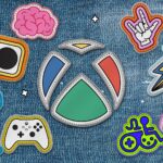 Xbox Collaborates Industry-Wide to Launch Accessible Gaming Initiative The Xbox logo as a patch sewn onto a denim jacket. The Xbox logo is surrounded by other patch versions of accessibility logos including the Xbox Adaptive Controller, the Game Accessibility Joyrider, the disability pride logo, and more.