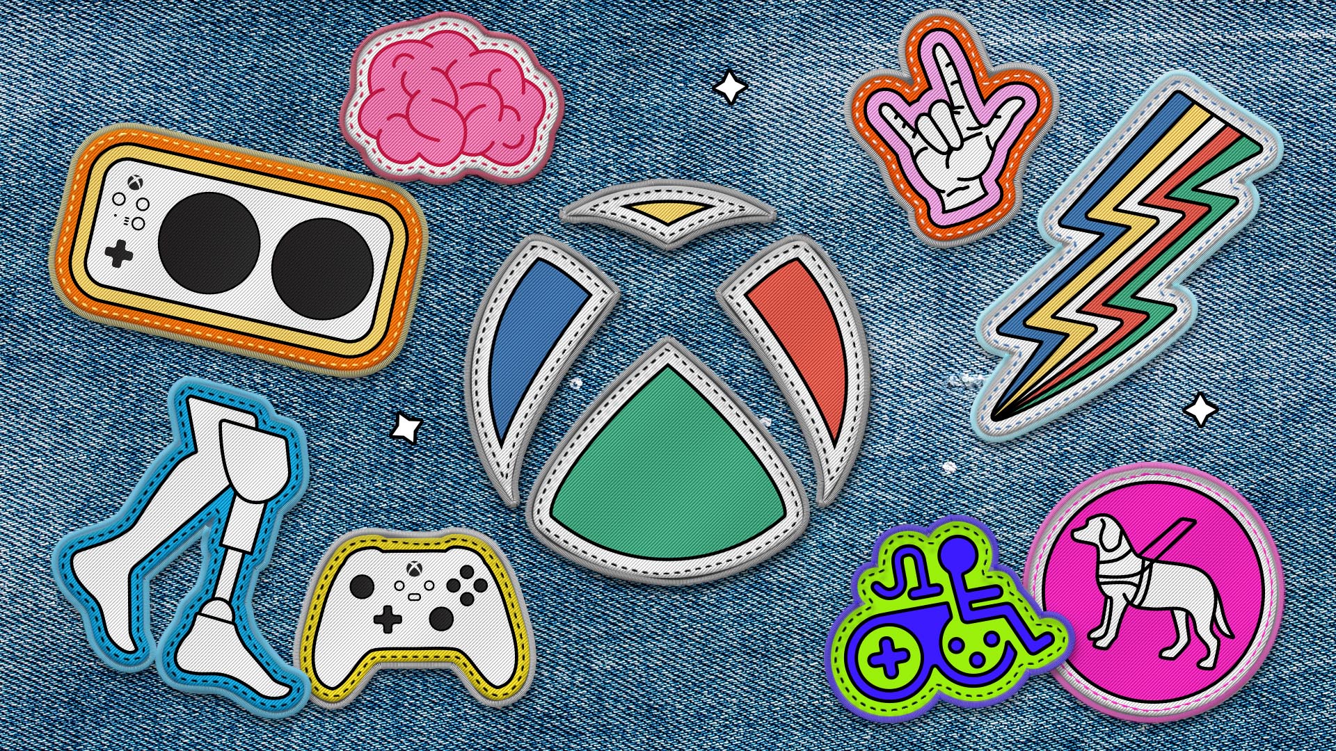 xbox disability community hero 213fde8fc362284334e5.jpg The Xbox logo as a patch sewn onto a denim jacket. The Xbox logo is surrounded by other patch versions of accessibility logos including the Xbox Adaptive Controller, the Game Accessibility Joyrider, the disability pride logo, and more.